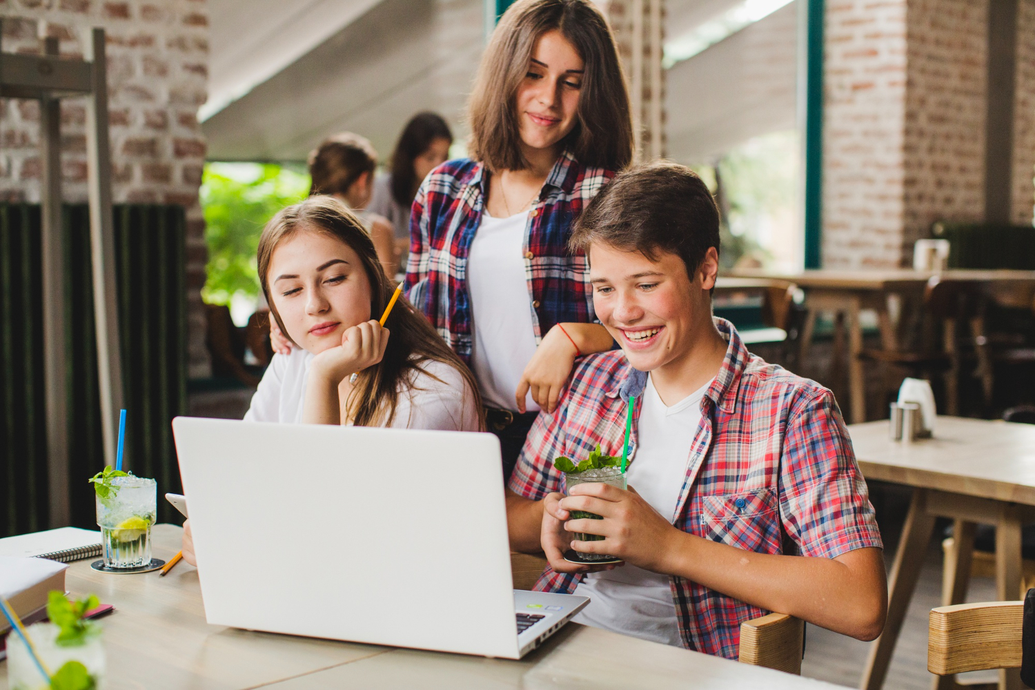 Students using a laptop for AI in education